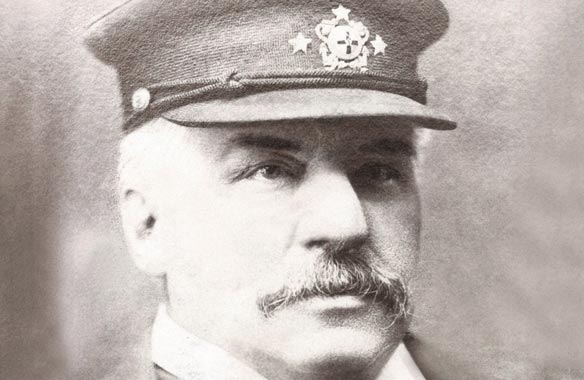 Black and white photo of J.P. Morgan wearing a captain's cap.